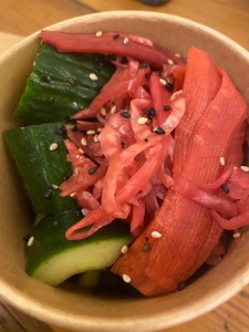 close up of pot of pickled carrot, cabbage, and smacked cucumber