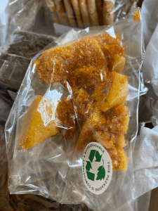 cellophane packet with honeycomb inside. sticker on packet reads 'biodegradable'